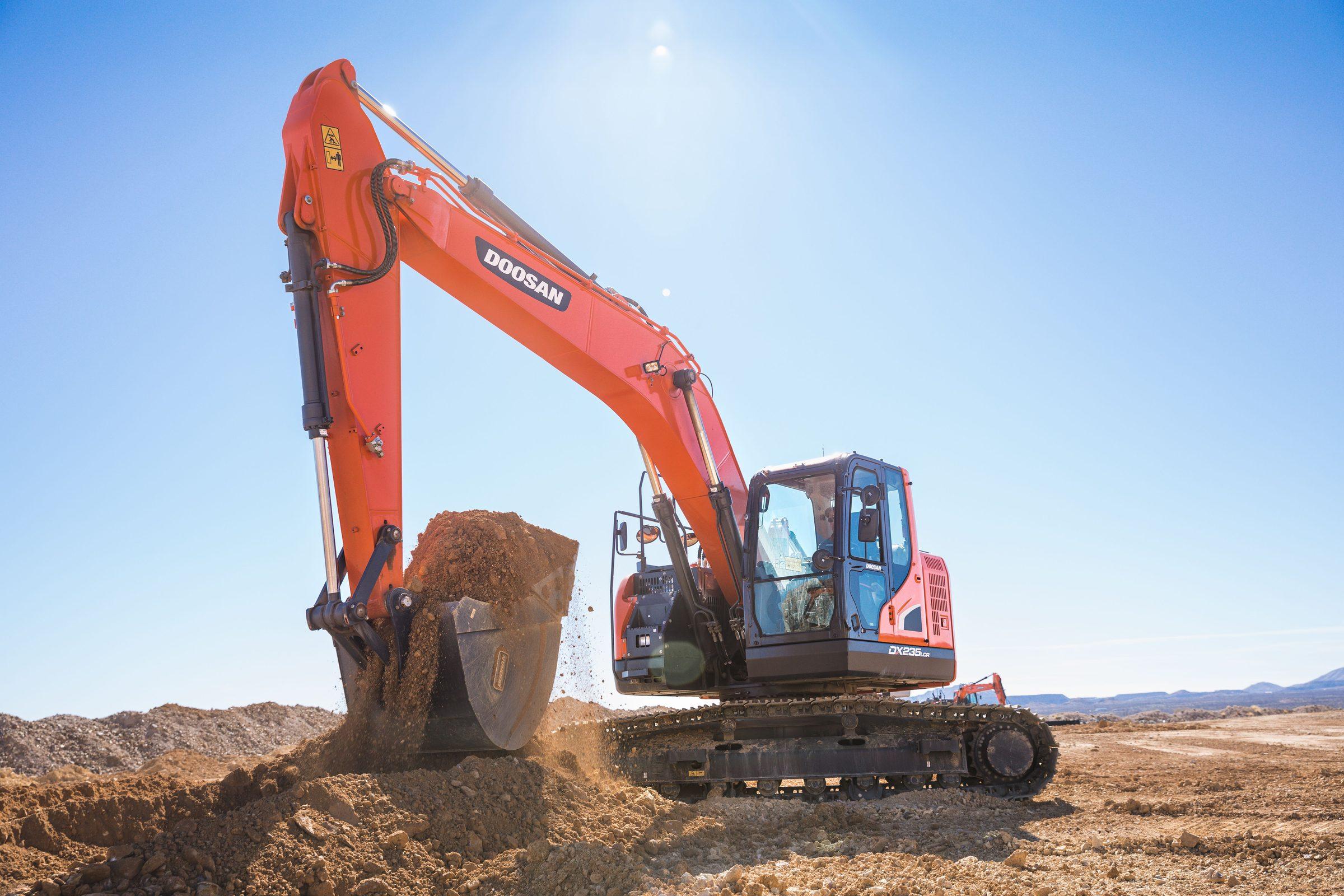 Excavator cutting into a slope on an active jobsite