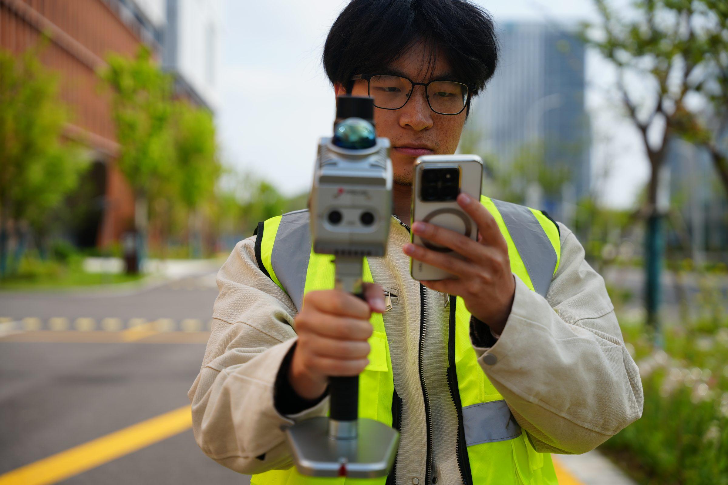 Operator reviewing a live S7 scan on a phone in the field